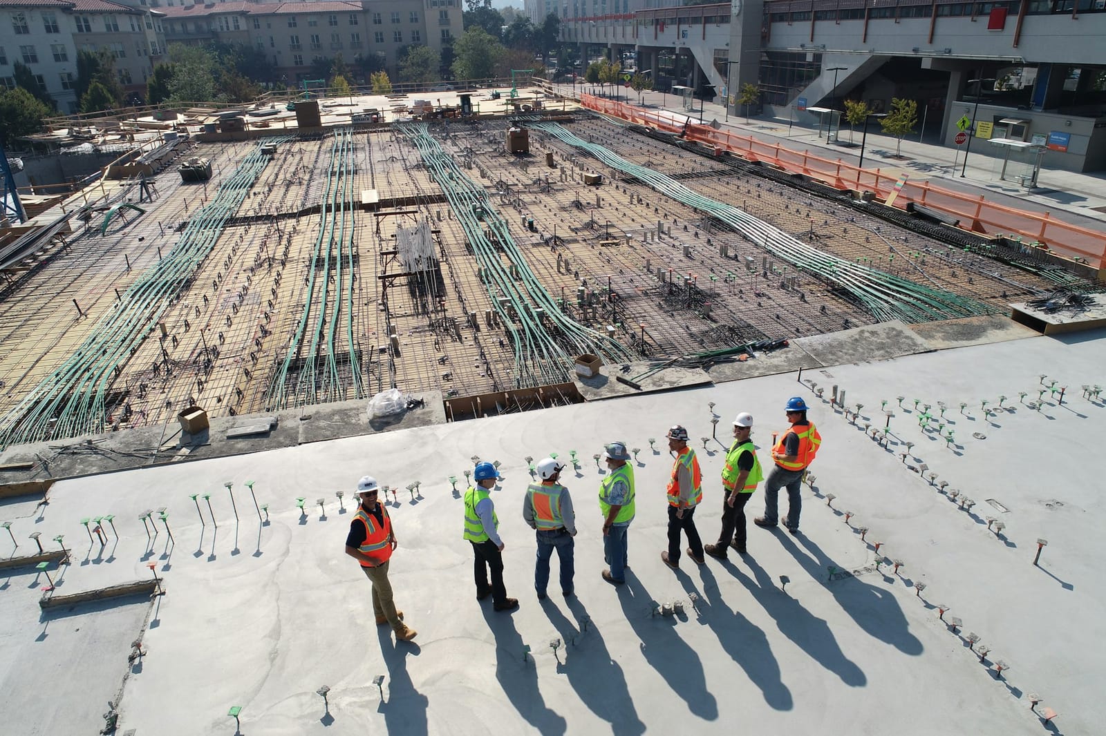 Construction crew on a commercial jobsite in safety gear