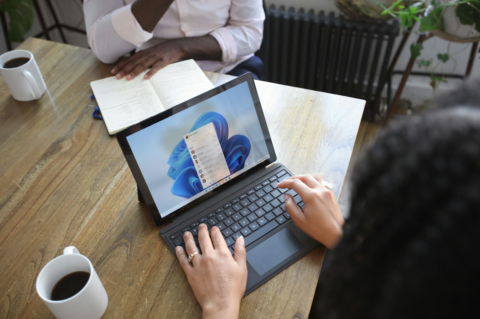 Microsoft 365 productivity setup with laptop and notebook